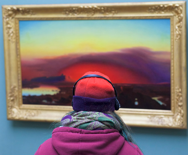 Her hat perfectly matches the painting!