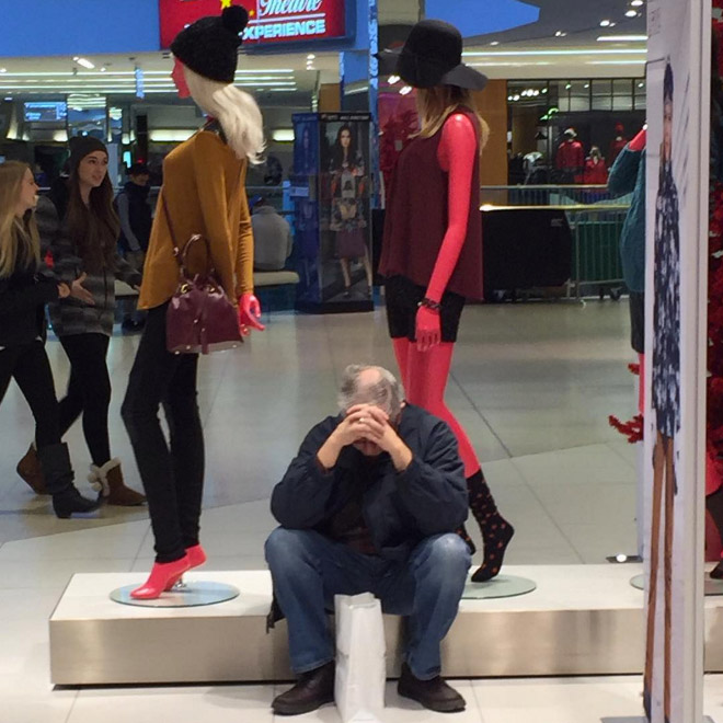 Miserable man trapped in the shopping hell.
