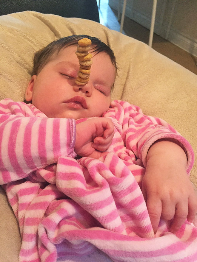 Weird viral trend: stacking Cheerio on babies.