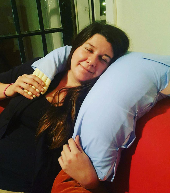 Lonely woman with a "boyfriend pillow".