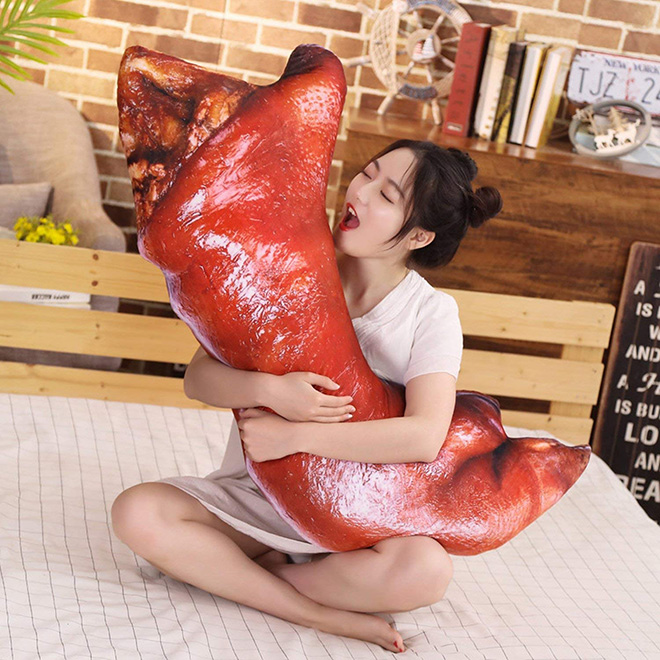 Creepy realistic pig's feet pillow from Japan.