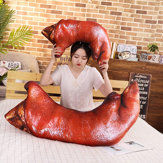 Creepy realistic pig's feet pillow from Japan.