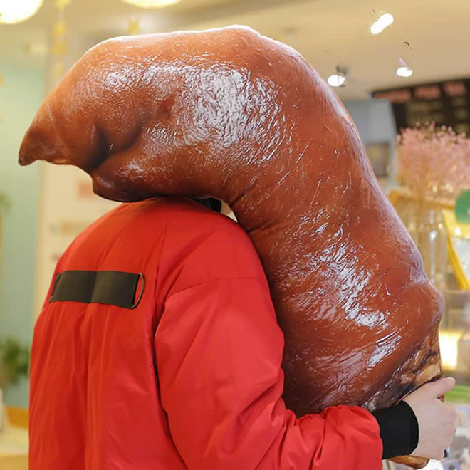 Creepy realistic pig's feet pillow from Japan.