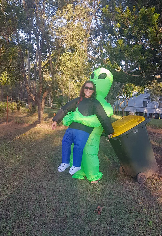 Taking out the trash in a costume.