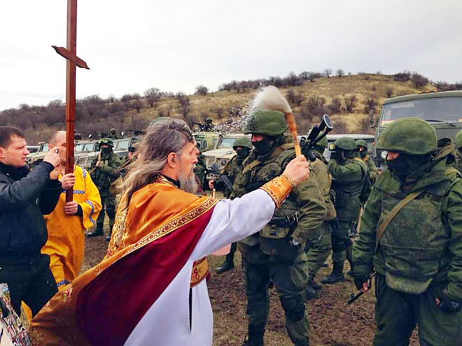 Russian priests really love blessing weapons.